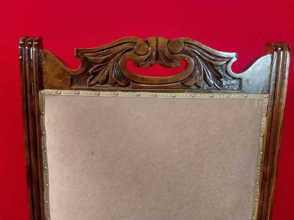 Carved oak antique upholstered nursing chair on castors