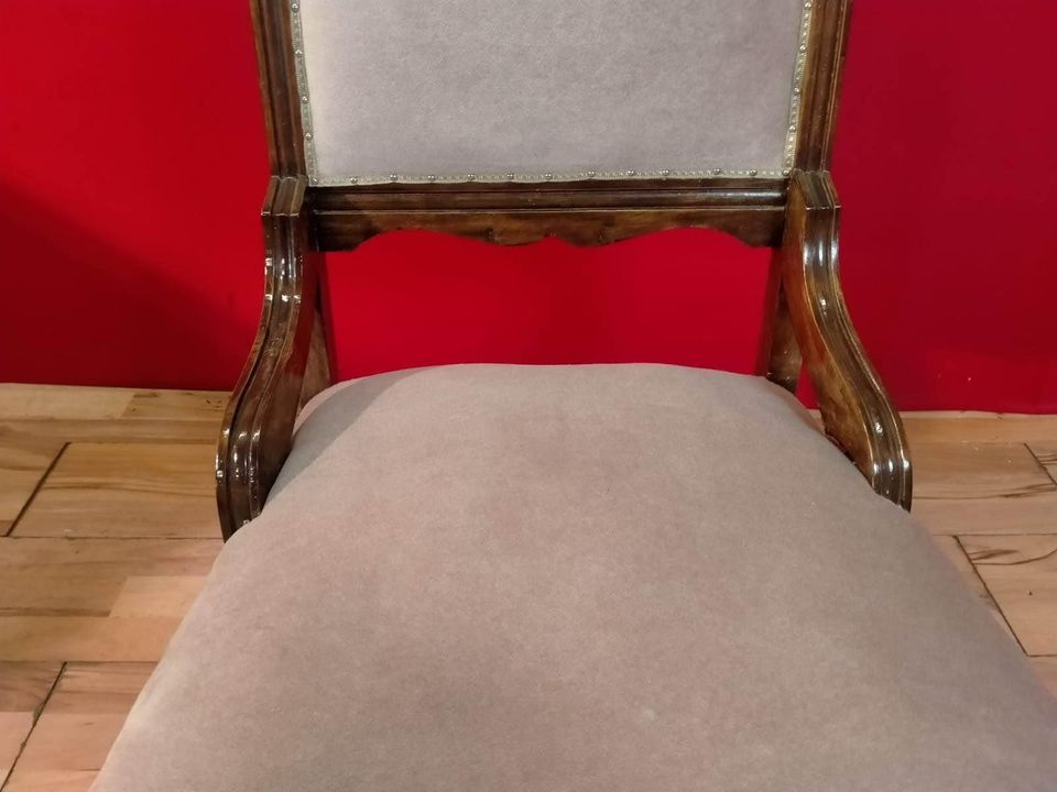 Carved oak antique upholstered nursing chair on castors